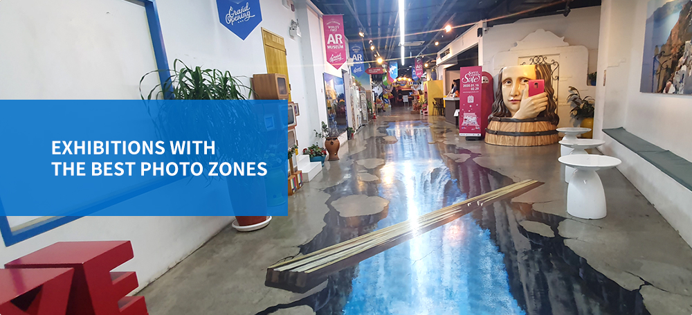 A photo zone showing a stream painted on the floor that shine with the title: Exhibitions with the best photo zones