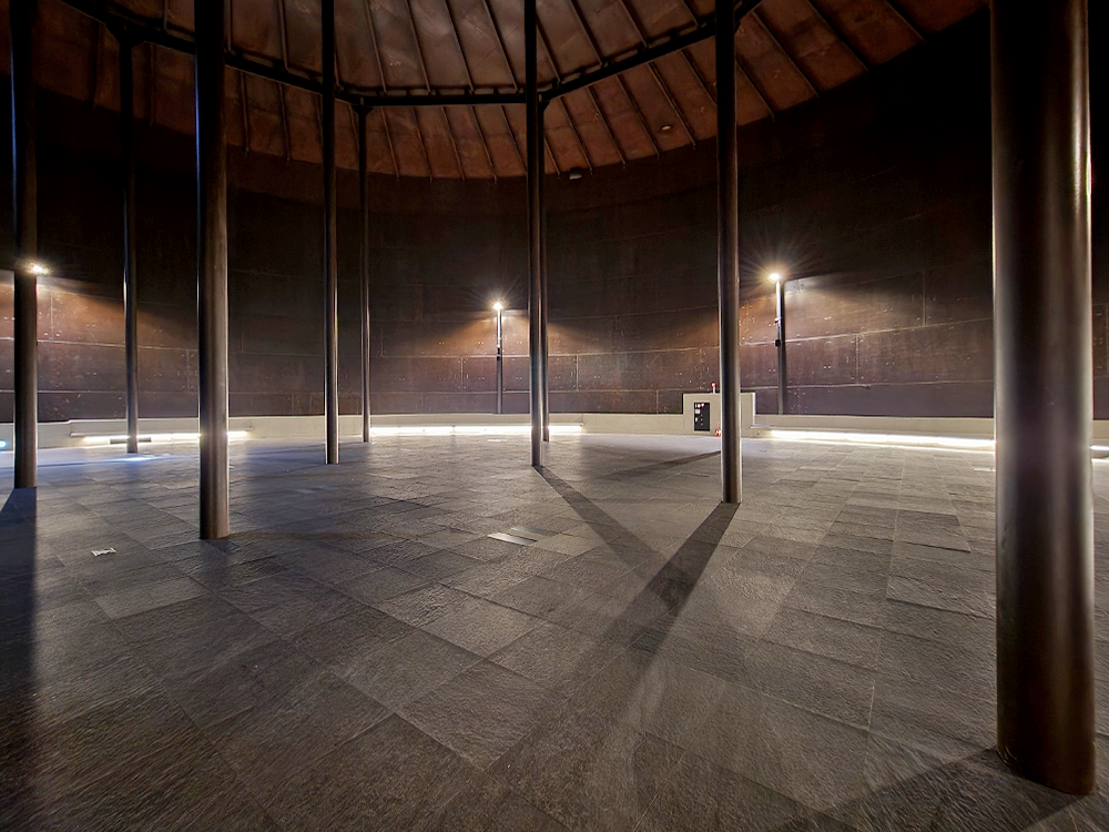 The interior of T4 of the Oil Tank Culture Park, where columns support an empty tank